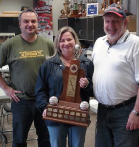 WE ARE THE CHAMPIONS: Elizabeth Alves holds the High Park’s Little League championship trophy from last season while Ernest Hudaj and Ken Sherbanowksi bask in the victory.